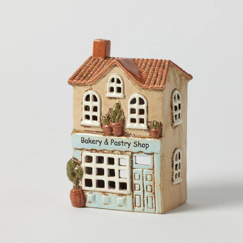 Bakery & Pastry Shop hand painted stoneware tealight holder with blue façade, arched windows and potted greenery