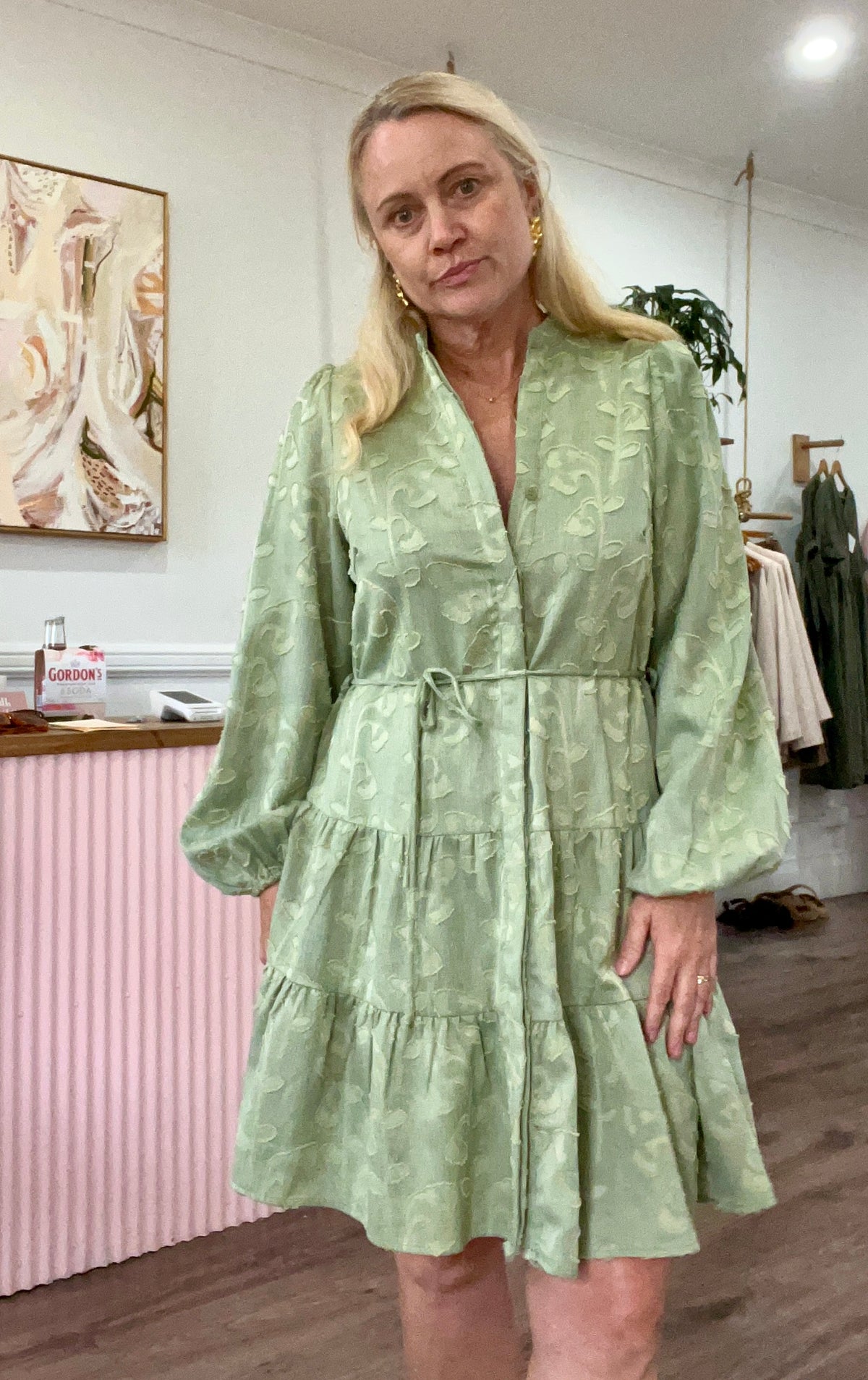 light green button through dress with embossed floral texture and v neck design