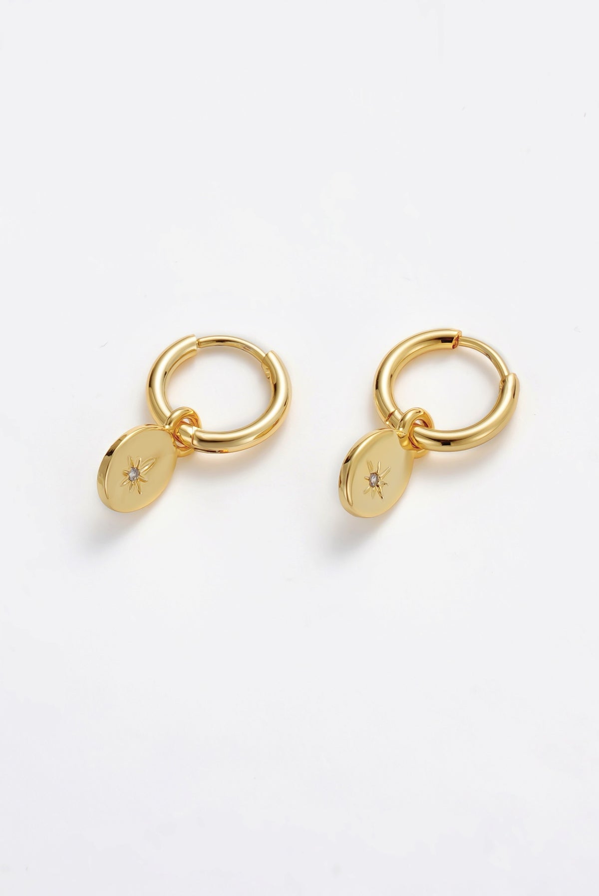 Nala Hoop Earrings in gold with crystal star disc charms
