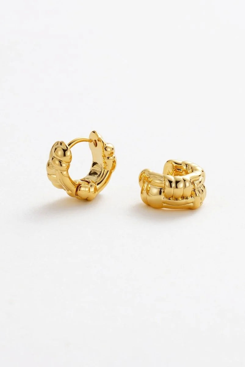 Small textured gold huggie earrings with high-shine finish