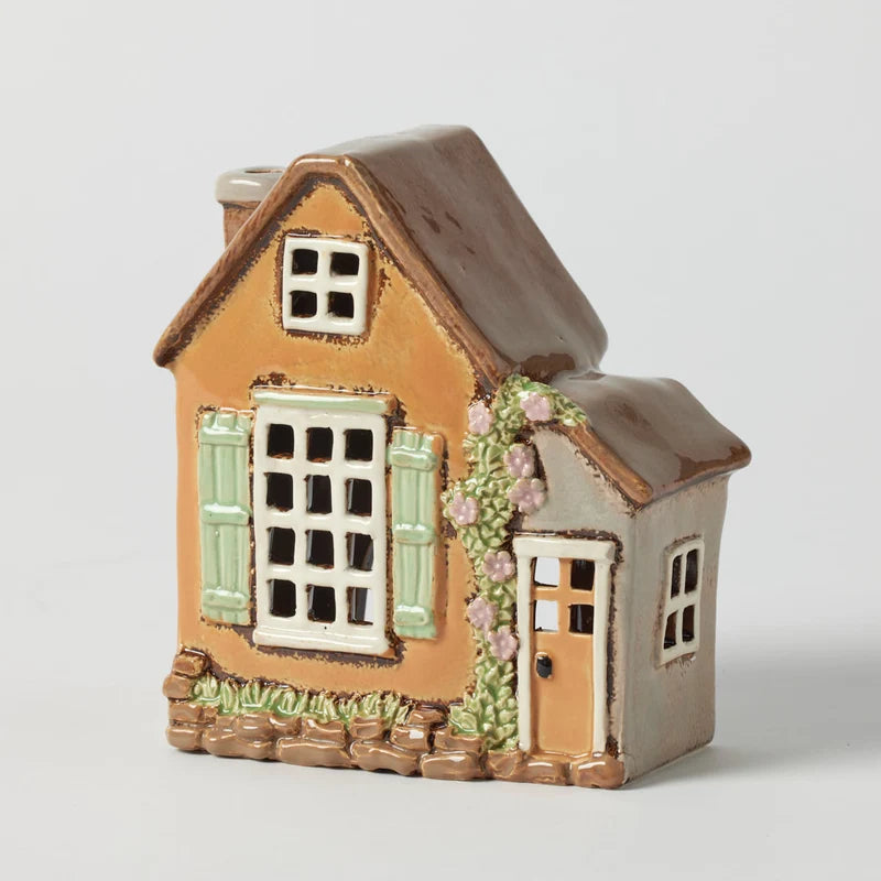 Sussex House hand painted stoneware tealight holder with ochre walls, green shutters and climbing florals
